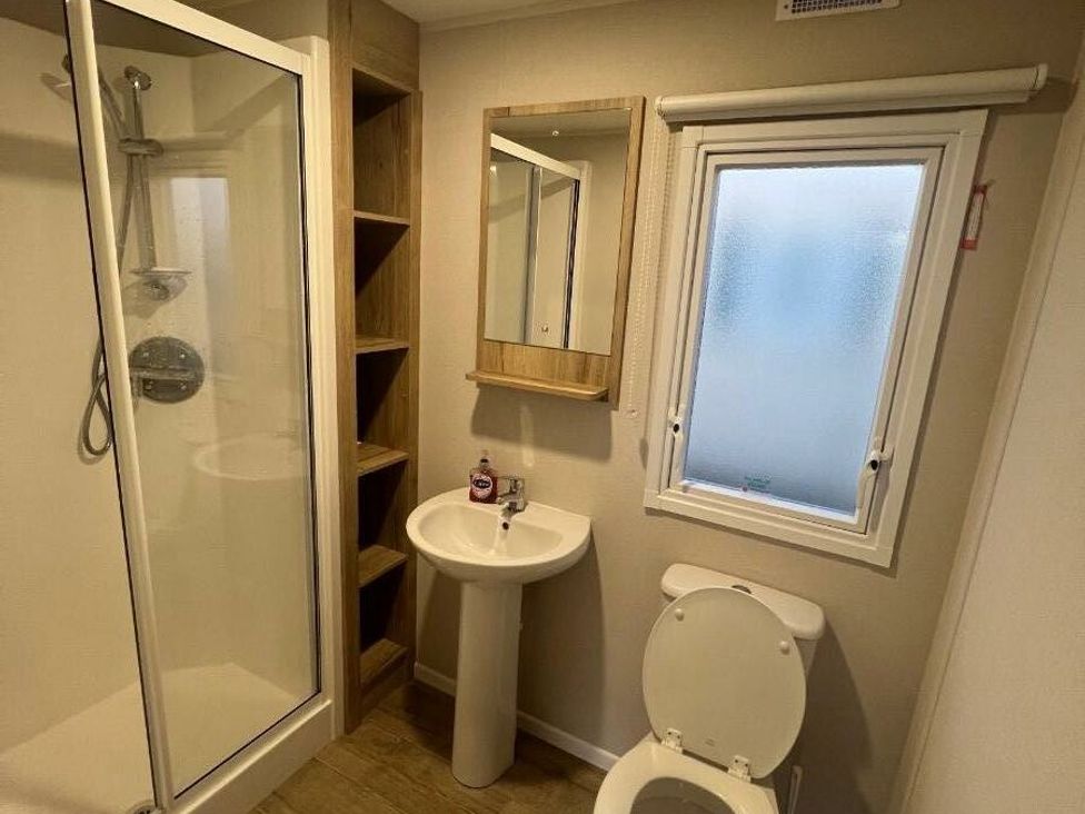 a bathroom with a shower, sink, and toilet at Golden Sands Kinmel Bay - Holiday Accommodation 20528, Rhyl