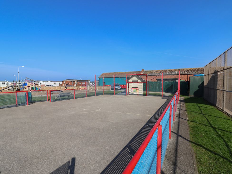 An outdoor sport court with a fence at Golden Sands Kinmel Bay - 20528, Rhyl