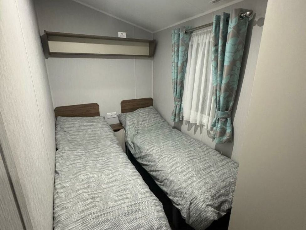 a room with two single beds and a window at Butlins Skegness - Holiday Accommodation 21028 Skegness