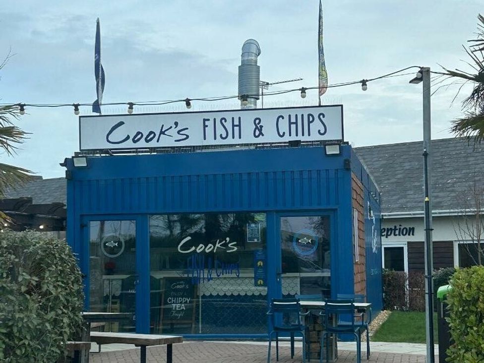 a fish and chips shop with a blue exterior and sign at Cala Gran Holiday Park - Holiday Accommodation 21106 Fleetwood