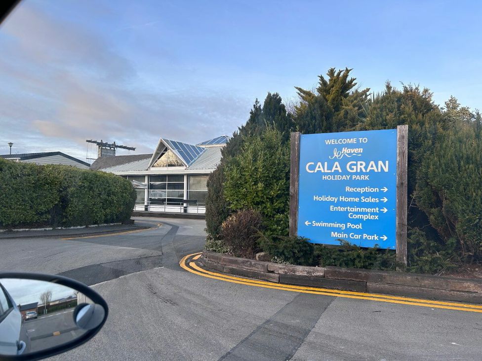 a sign directing to various facilities at Cala Gran Holiday Park including reception and swimming pool in Fleetwood