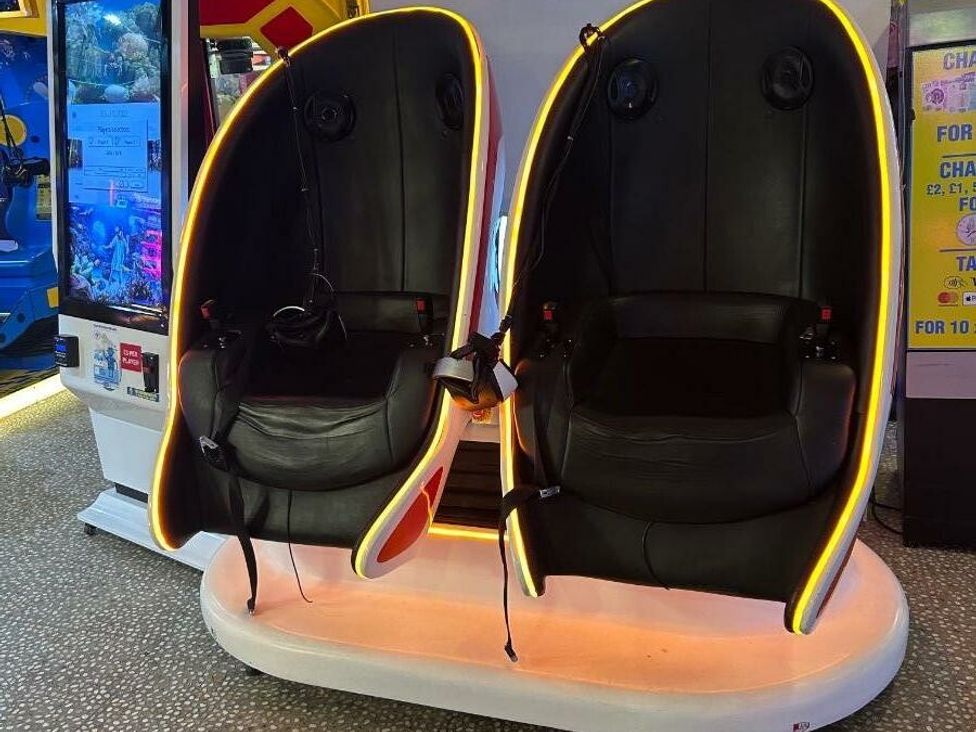 two gaming seats with a futuristic design and neon lighting at Cala Gran Holiday Park - Holiday Accommodation 21106 Fleetwood