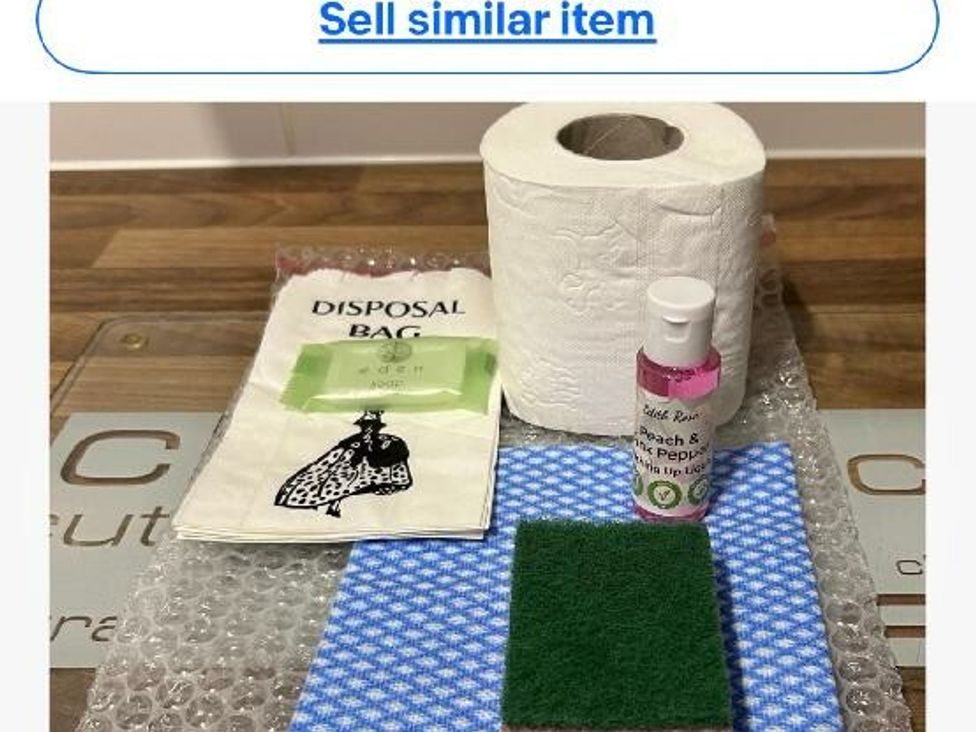 a paper towel roll, a sponge, a small bottle, a disposal bag, and a blue cloth at Cala Gran Holiday Park - Holiday Accommodation 21106, Fleetwood