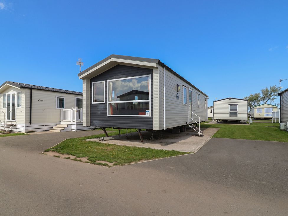 A mobile home in an outdoor area at Ty Mawr Holiday Park - Holiday Accommodation 21121, Ty Mawr