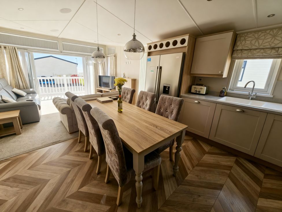 A dining room with a table and chairs at Ocean Edge Leisure Park - Holiday Accommodation 21286 Morecambe