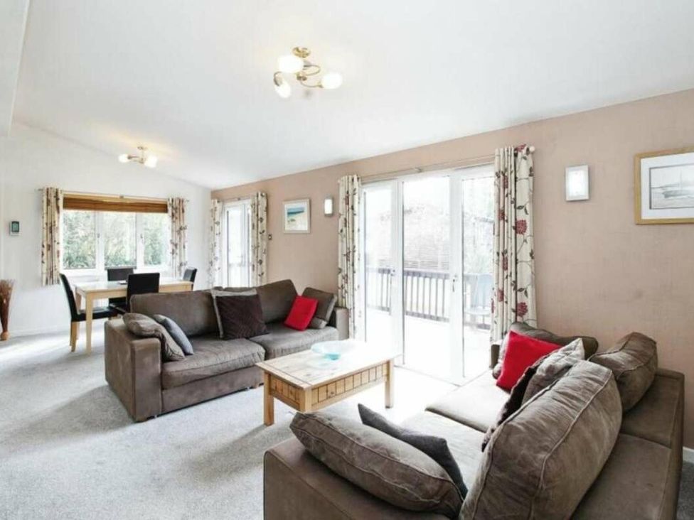a living room with two sofas and a coffee table at St Minver Holiday Park - Holiday Accommodation 21443 in Wadebridge