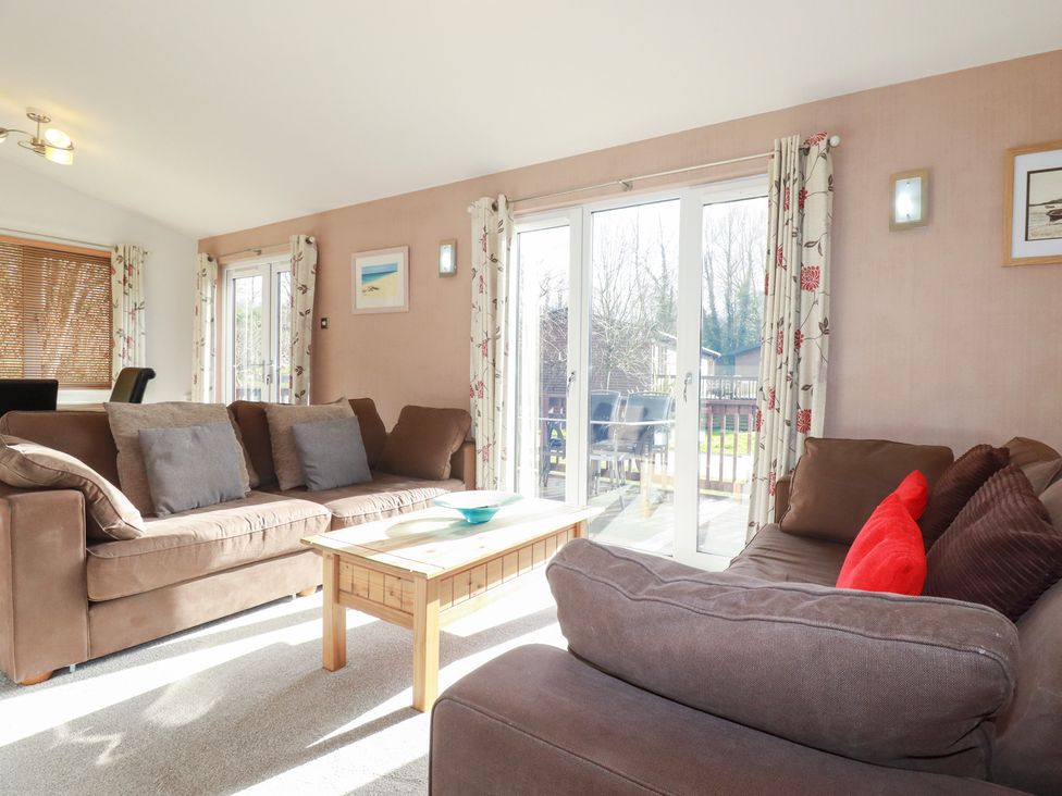 A living room with sofas and a coffee table at St Minver Holiday Park - Holiday Accommodation 21443, Wadebridge