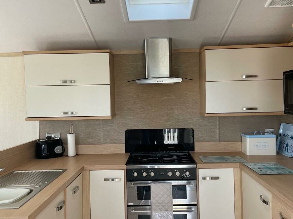 a kitchen with cabinets and a stove at Waterside, Paignton - Holiday Accommodation 22105, Paignton