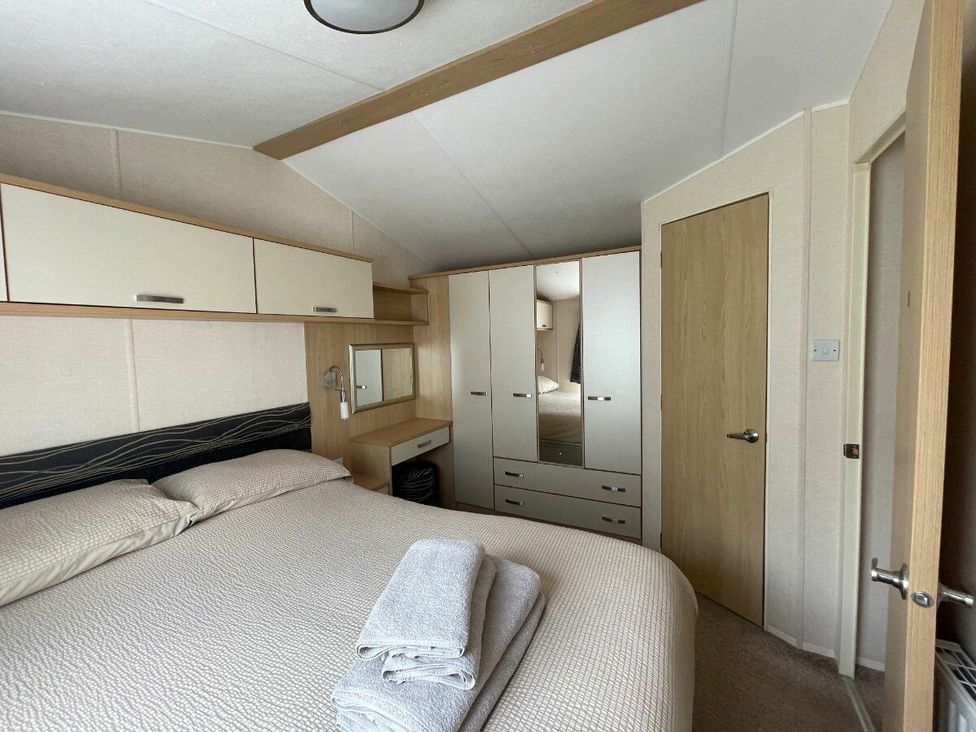 a bedroom with a double bed and wardrobe at Waterside, Paignton - Holiday Accommodation 22105 in Paignton