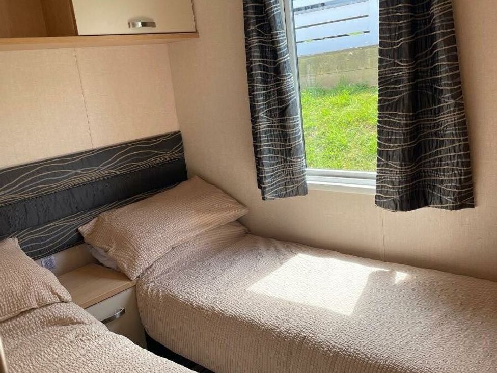 a bedroom with two single beds and a window at Waterside, Paignton - Holiday Accommodation 22105 in Paignton