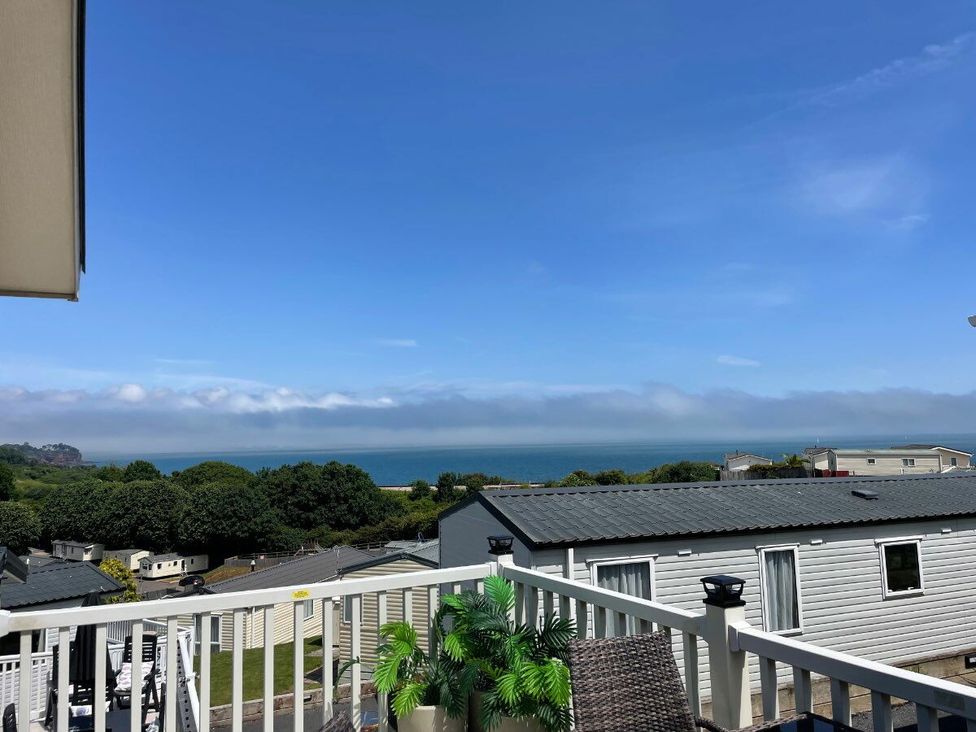 a view of the sea and cloudy sky from a balcony at Waterside, Paignton - Holiday Accommodation 22105, Paignton