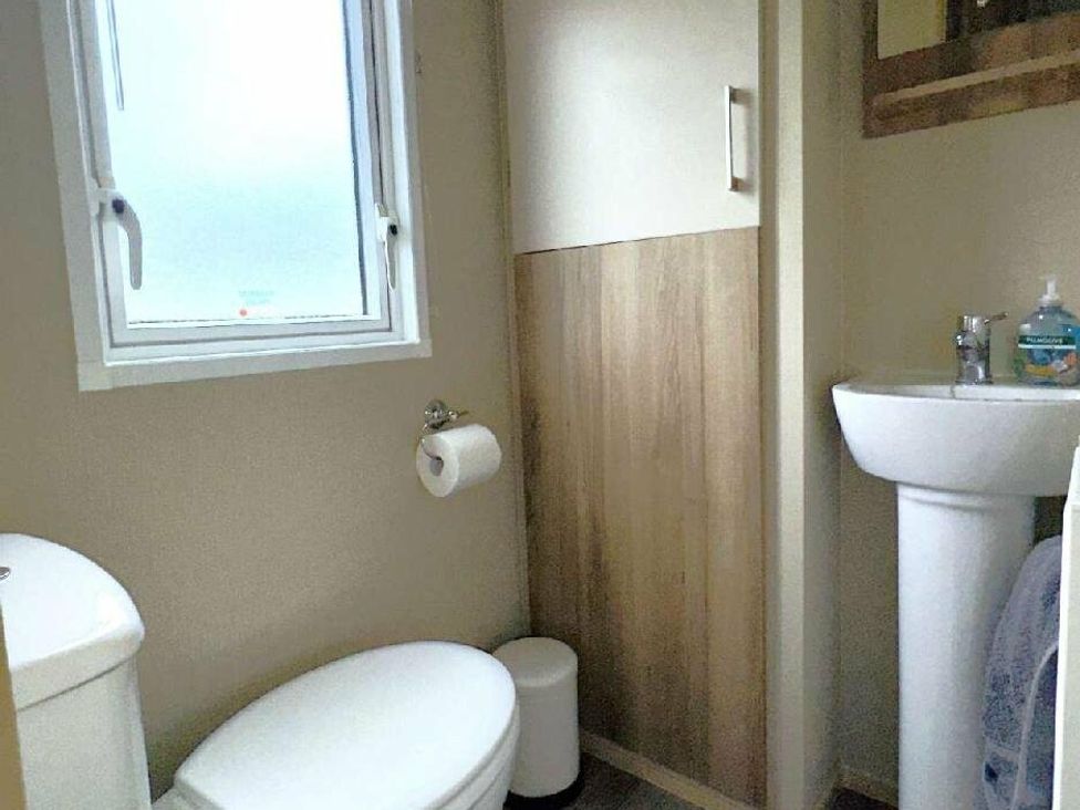 a bathroom with a toilet and a sink at St Andrews Holiday Park - Holiday Accommodation 609, St. Andrews