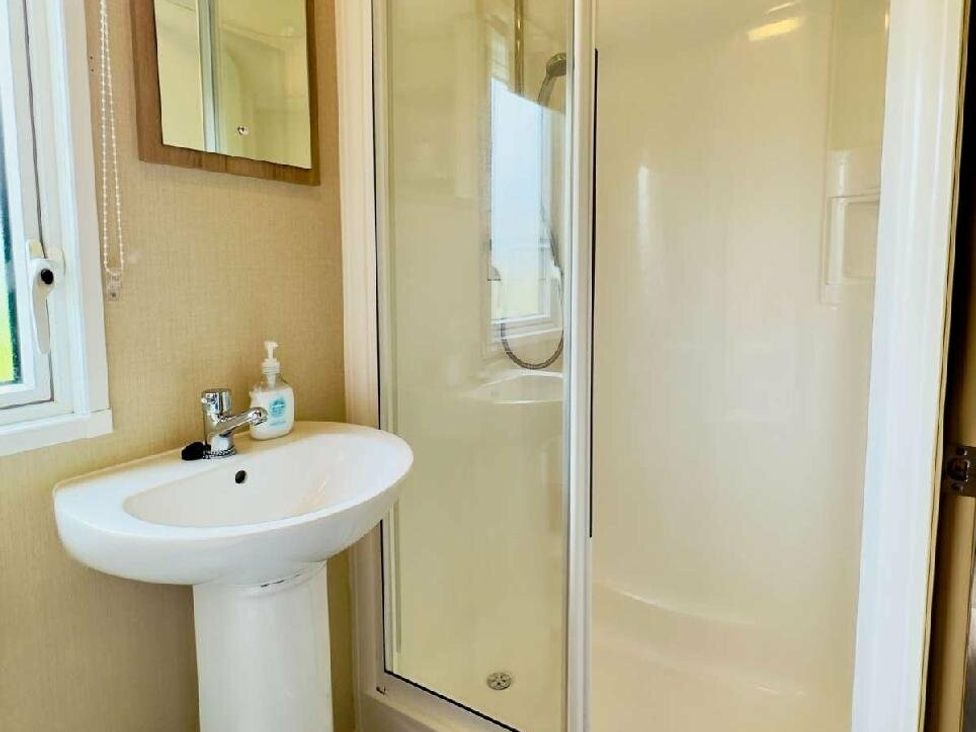 a bathroom with a shower and sink at St Andrews Holiday Park - Holiday Accommodation 609, St. Andrews