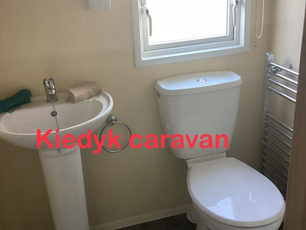a bathroom with a sink and toilet at Kiedyk caravan in Skegness