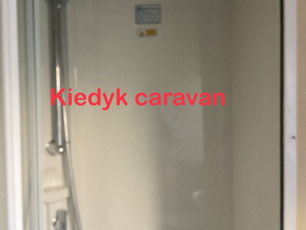 a shower space with a showerhead in the Kiedyk caravan at Southview Holiday Park - Holiday Accommodation 7251 Skegness