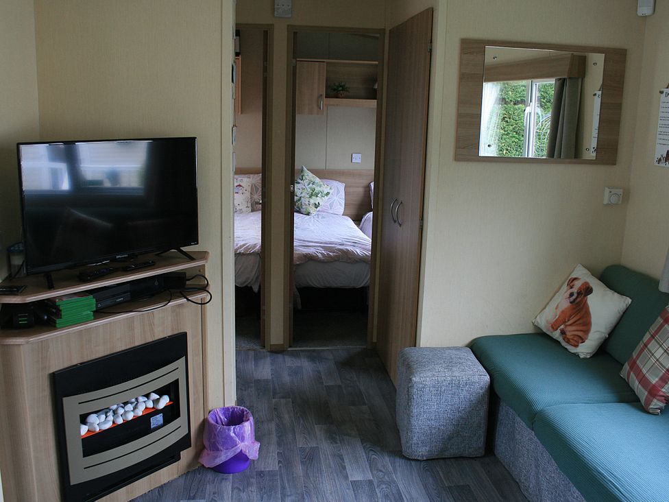 A living room with a television and sofa at Southview Holiday Park 7251 Skegness