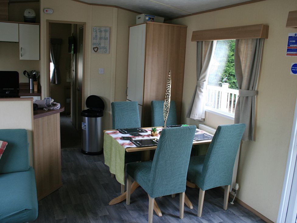 A dining room with a table and chairs at Southview Holiday Park 7251 Skegness