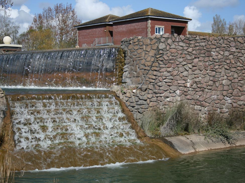 A waterfall beside a brick building at Southview Holiday Park 7251 Skegness