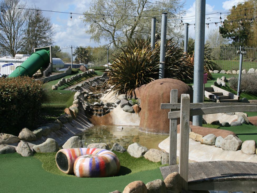 An outdoor area with a slide, water feature, and bridge at Southview Holiday Park 7251 Skegness