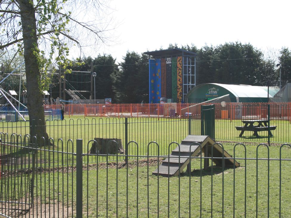 An outdoor playground with climbing structures and a picnic table at Southview Holiday Park 7251 Skegness