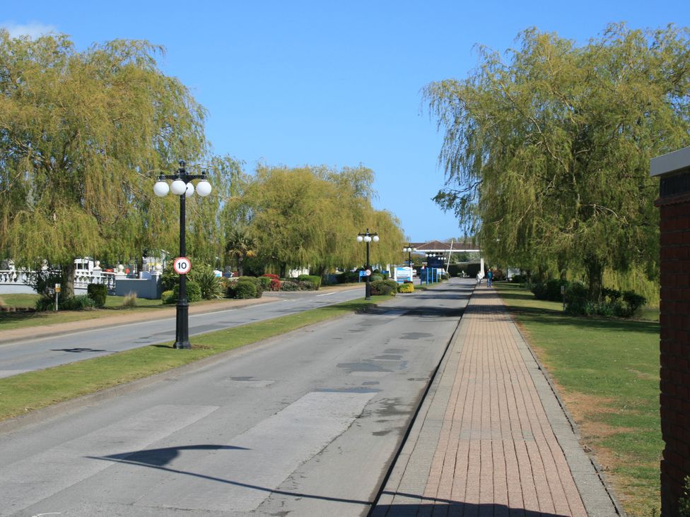 A street with trees and lamp posts at Southview Holiday Park 7251 Skegness