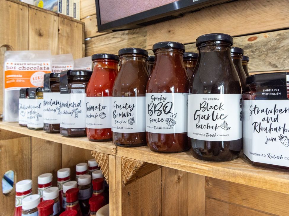 Shelf with various sauces and condiments at Coniston in Penrith