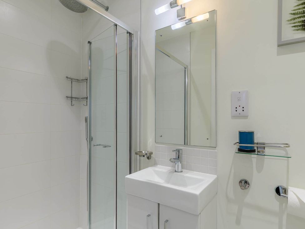 A bathroom with a shower and sink at Lakeside Studio Portreath