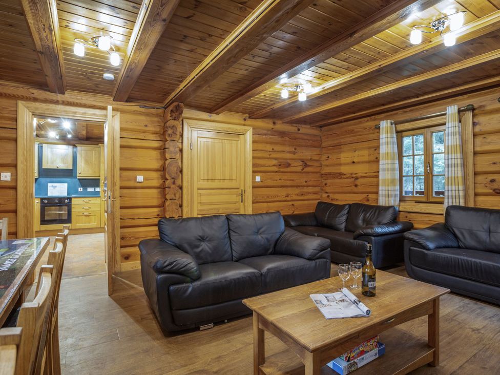A living room with sofas and a coffee table at Kinder Lodge (Pet) Fowlis near Dundee