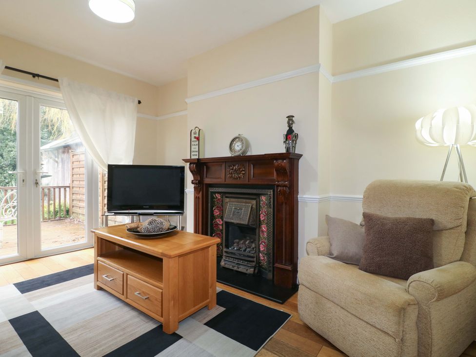 A living room with a sofa and coffee table at 5 Wallace Road in Loughborough