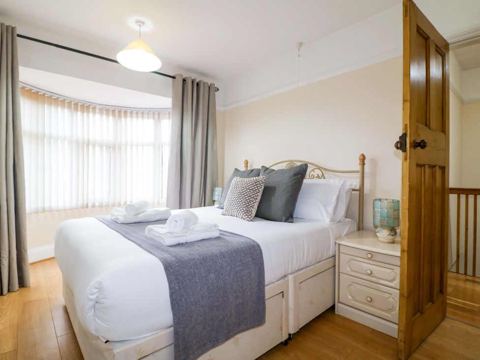 A bedroom with a bed and bedside table at 5 Wallace Road, Loughborough