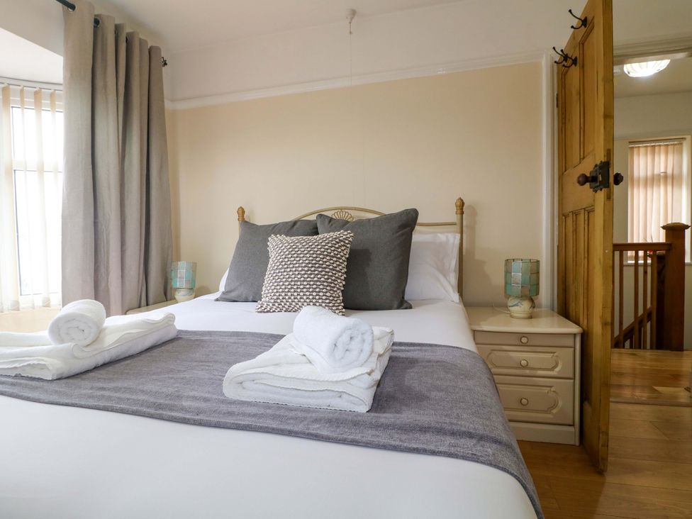 A bedroom with a bed and bedside table at 5 Wallace Road Loughborough