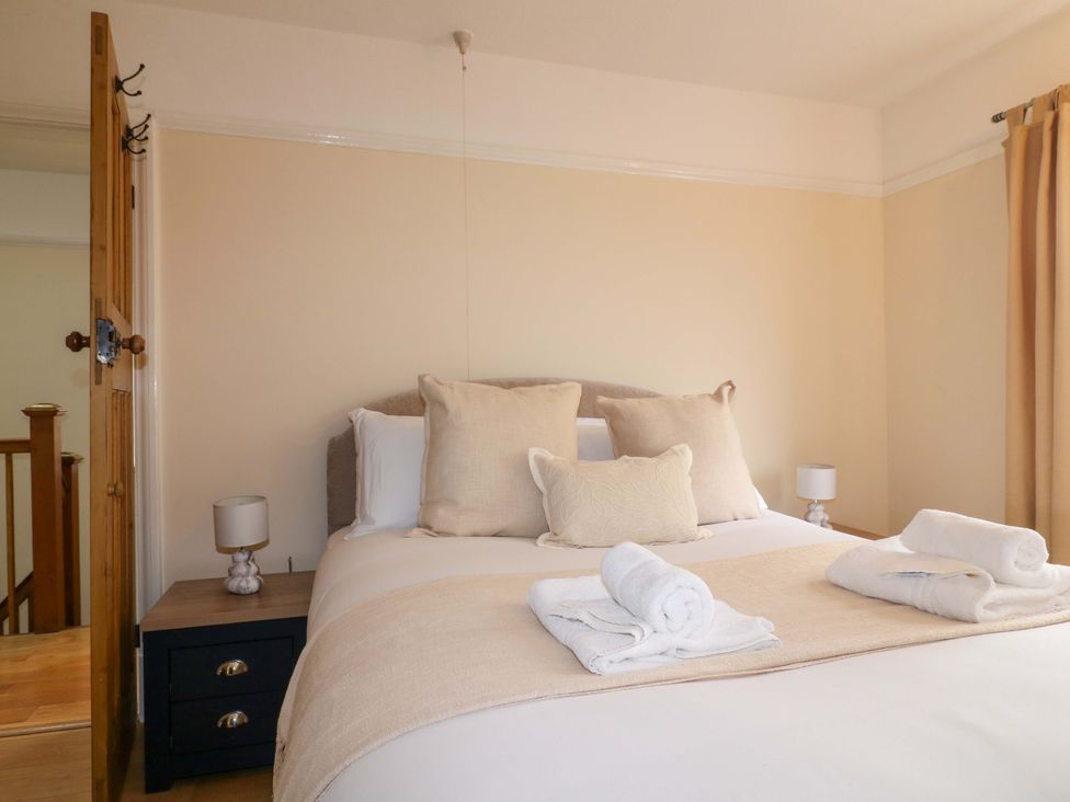 A bedroom with a bed and bedside table at 5 Wallace Road in Loughborough