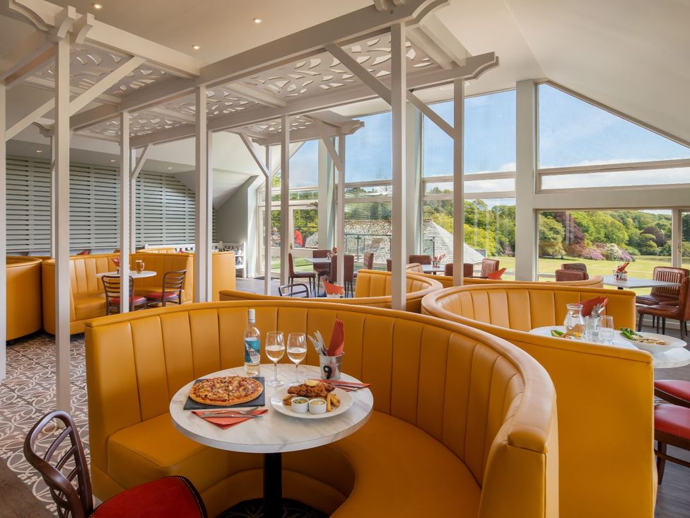 A restaurant with booth seating and tables at St Ives Studio in Praze-An-Beeble