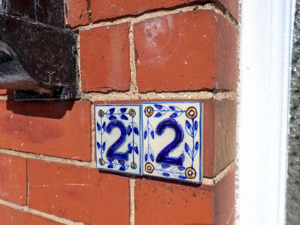 Number tiles on a brick wall at 22 The Lane Saltburn-by-the-Sea