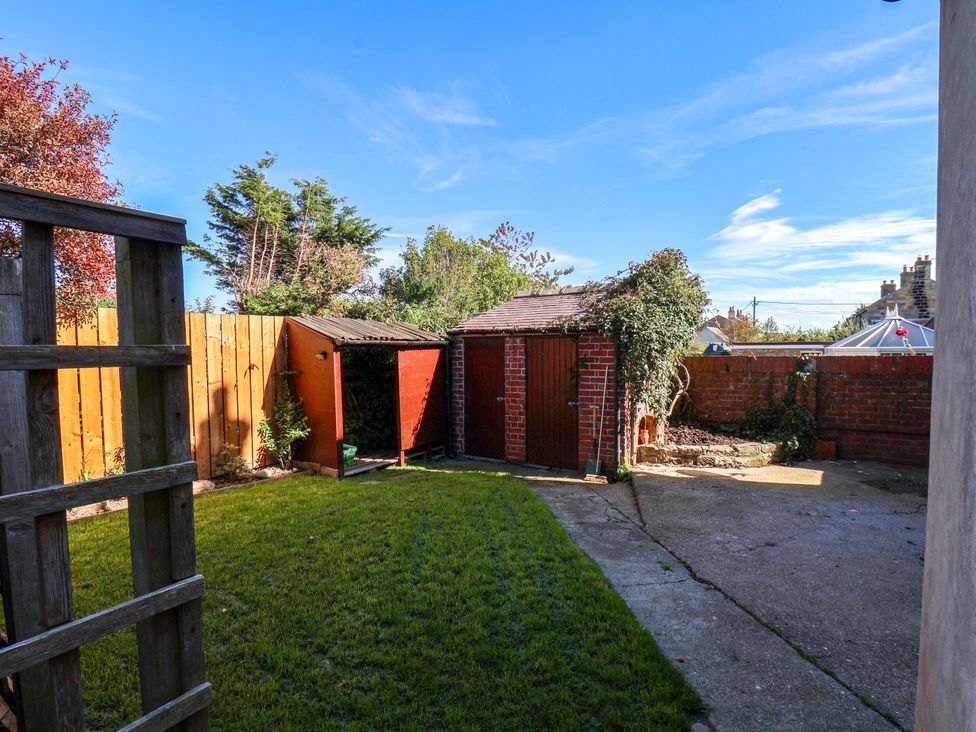 A garden with sheds and grass at 22 The Lane, Saltburn-by-the-Sea