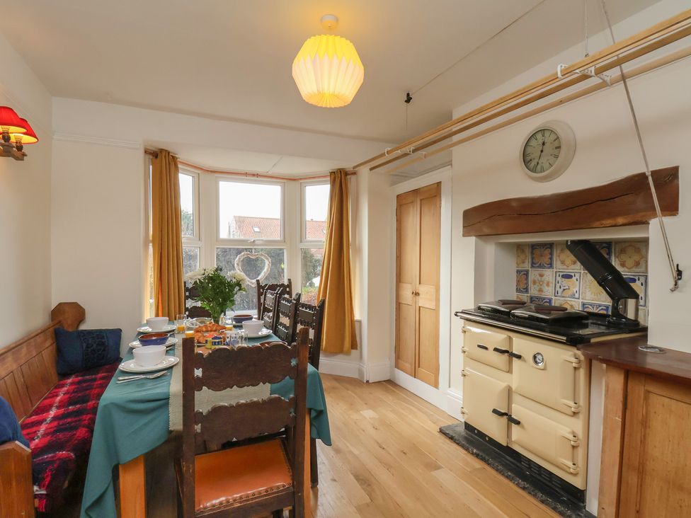 A dining room with a table and chairs at The Manse in Whitby