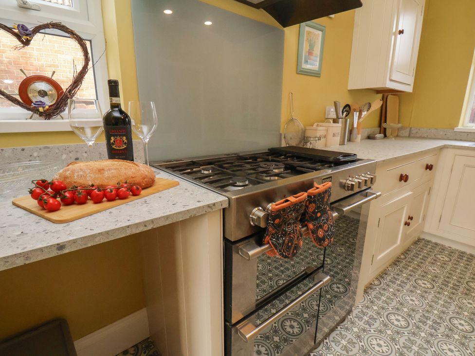 A kitchen with a stove and ingredients at The Manse in Whitby