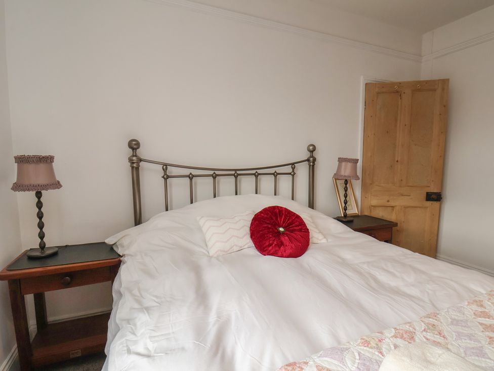 A bedroom with a bed and lamps at The Manse in Whitby