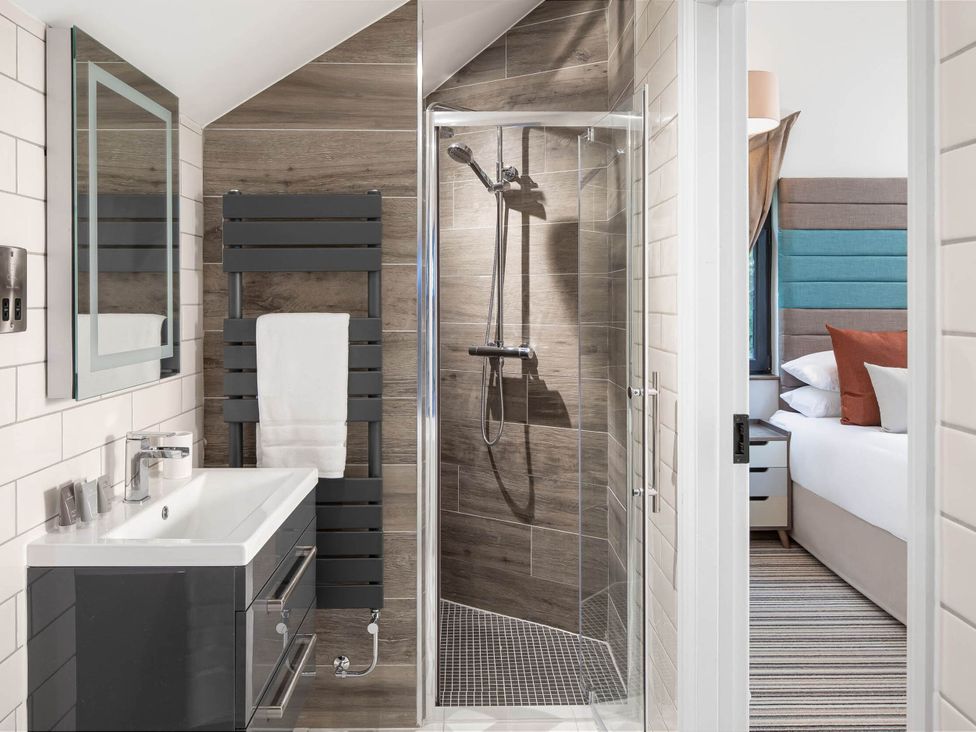 A bathroom with shower and basin at Ferry Hills in Laugharne