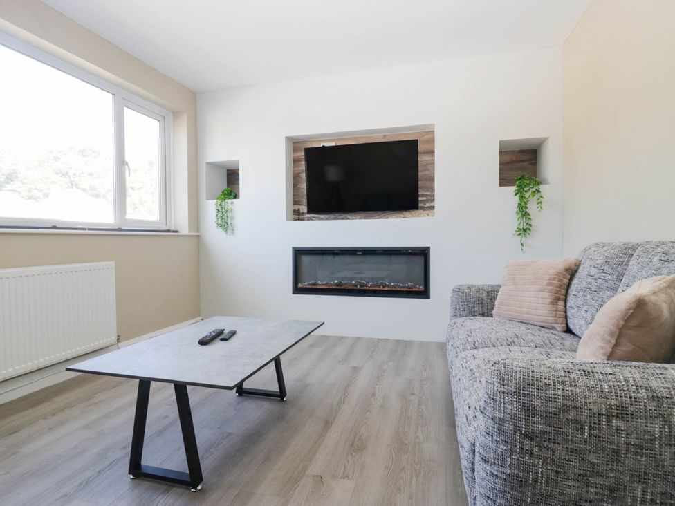 A living room with a sofa and coffee table at Aqueduct Residence, Lancaster