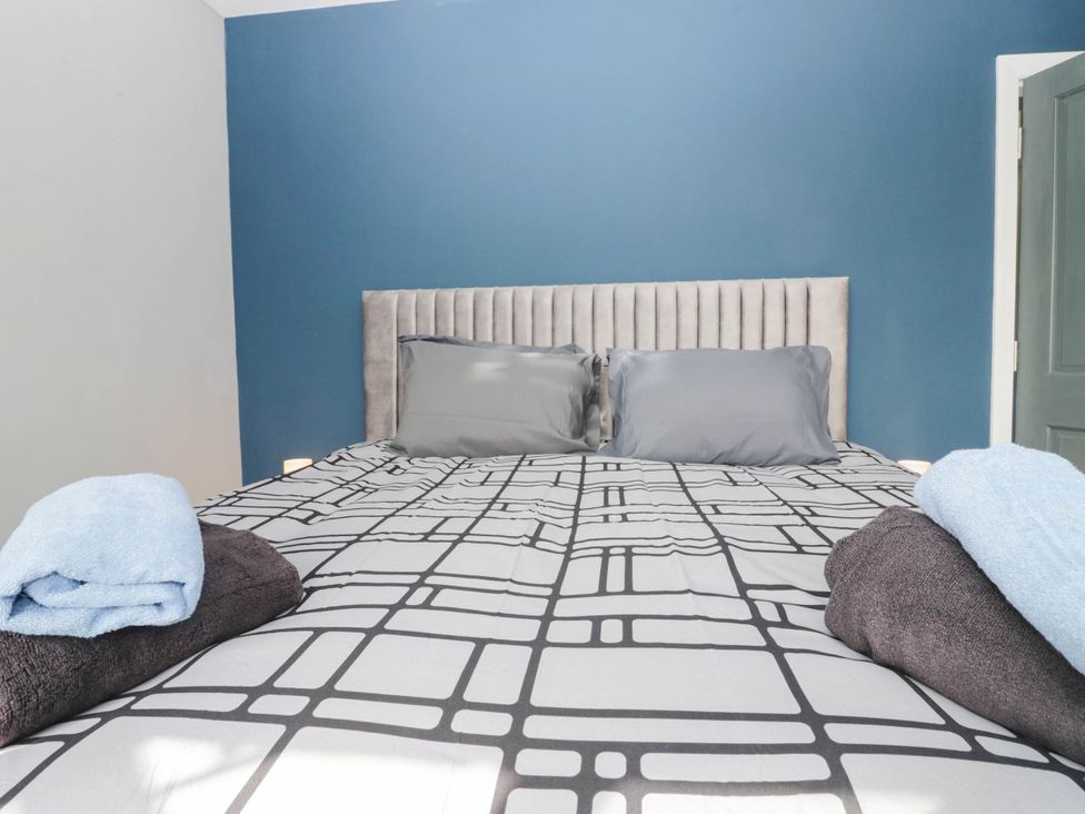 A bed with pillows and towels at Aqueduct Residence in Lancaster