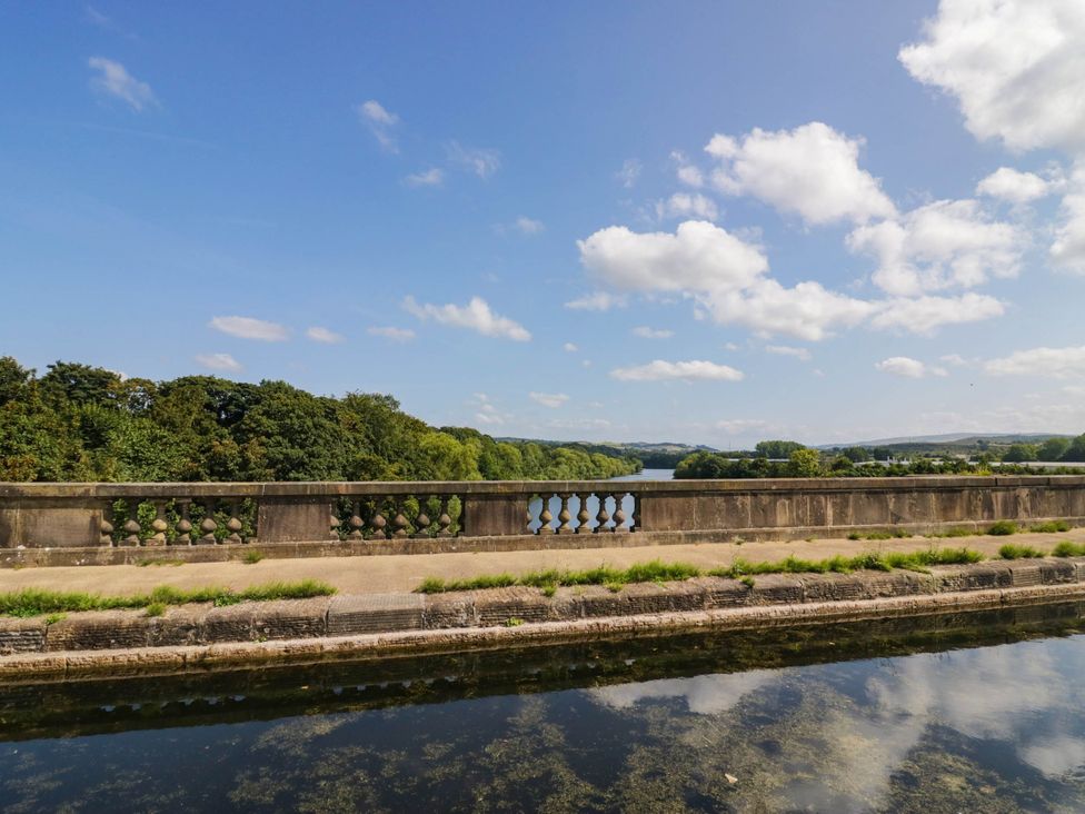 A view of a waterway with a balustrade and trees at Aqueduct Residence in Lancaster