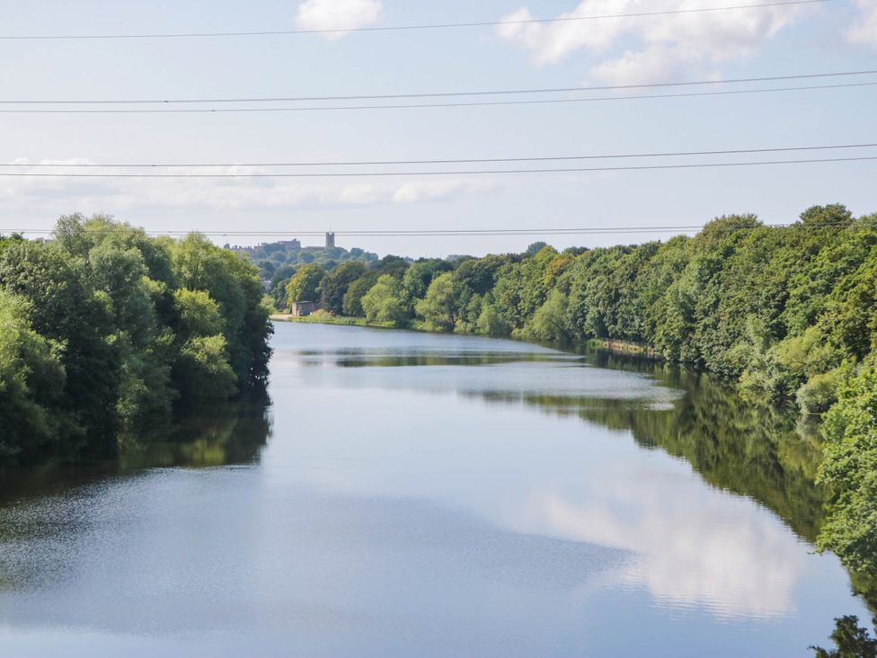 A river with trees and power lines at Aqueduct Residence in Lancaster