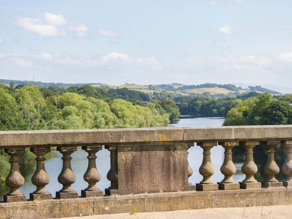 A view of a river with greenery and hills at Aqueduct Residence in Lancaster
