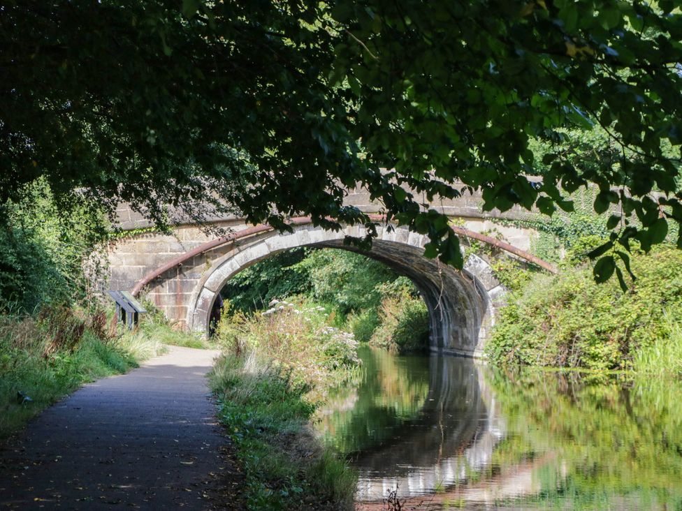 A bridge over a canal with a pathway at Aqueduct Residence in Lancaster