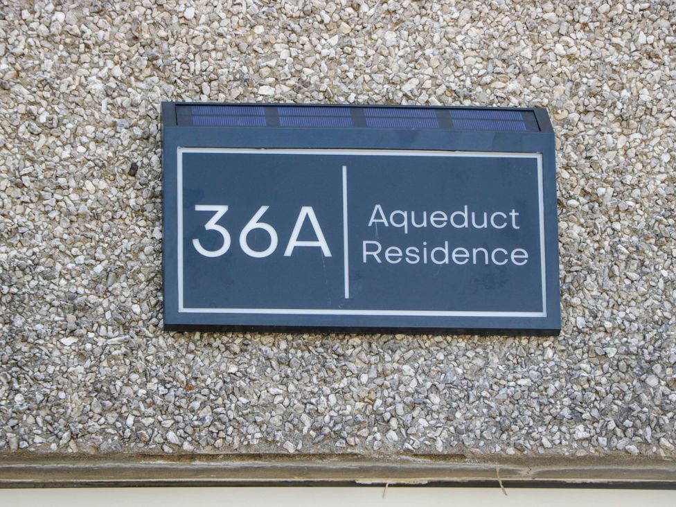 A sign indicating 36A Aqueduct Residence