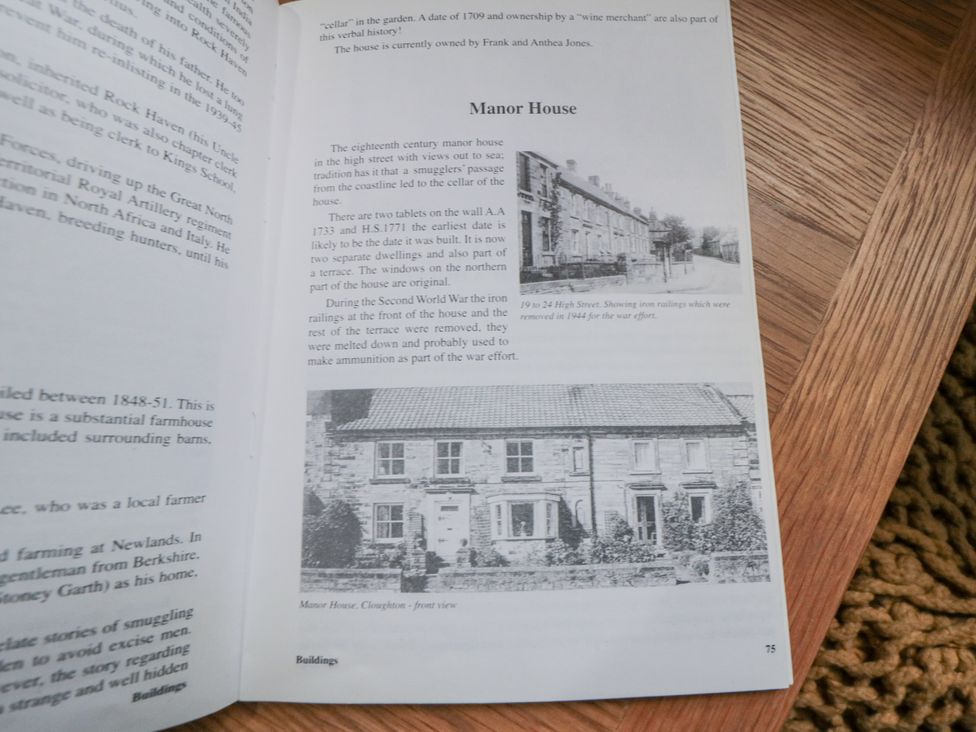 A page from a book with text and a photograph of Manor House at 21 High Street, Scarborough