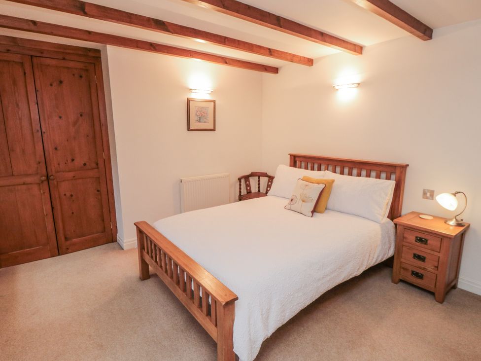 A bedroom with a bed and nightstand at 21 High Street, Scarborough