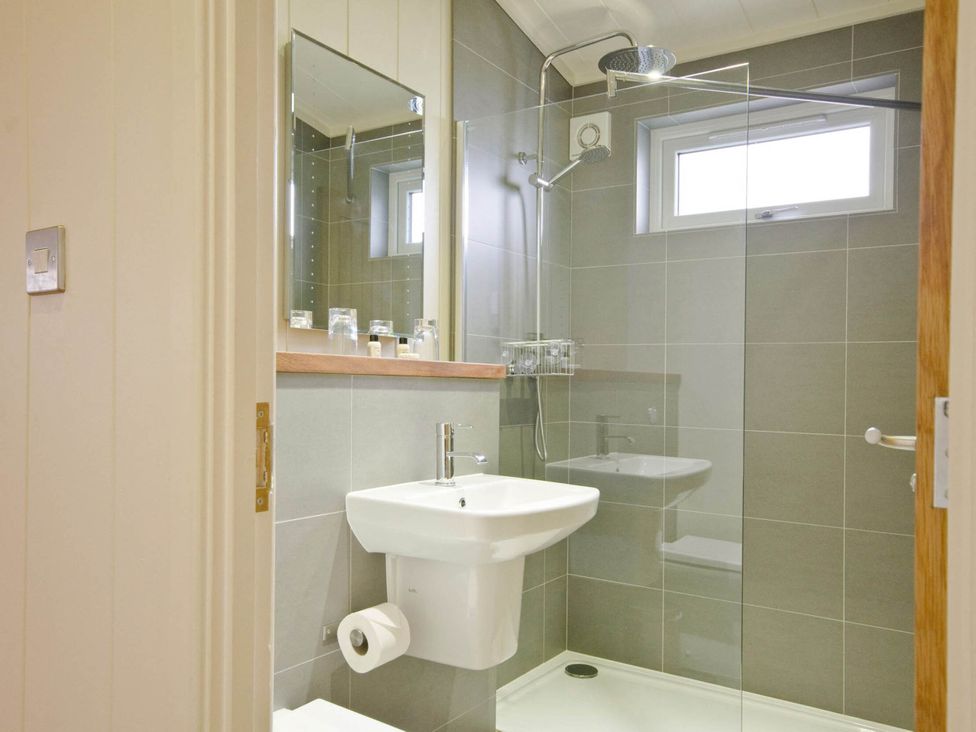 A bathroom with a sink and shower at Lawson in Wigton