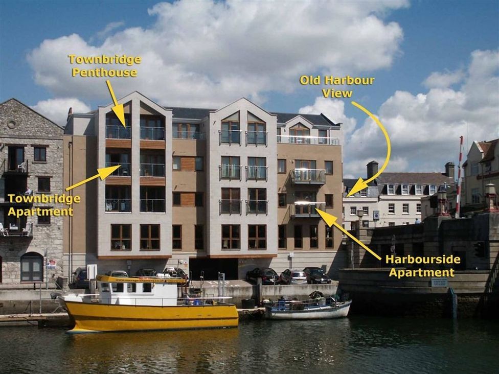 An exterior view of buildings along the water at Harbourside Apartment in Weymouth